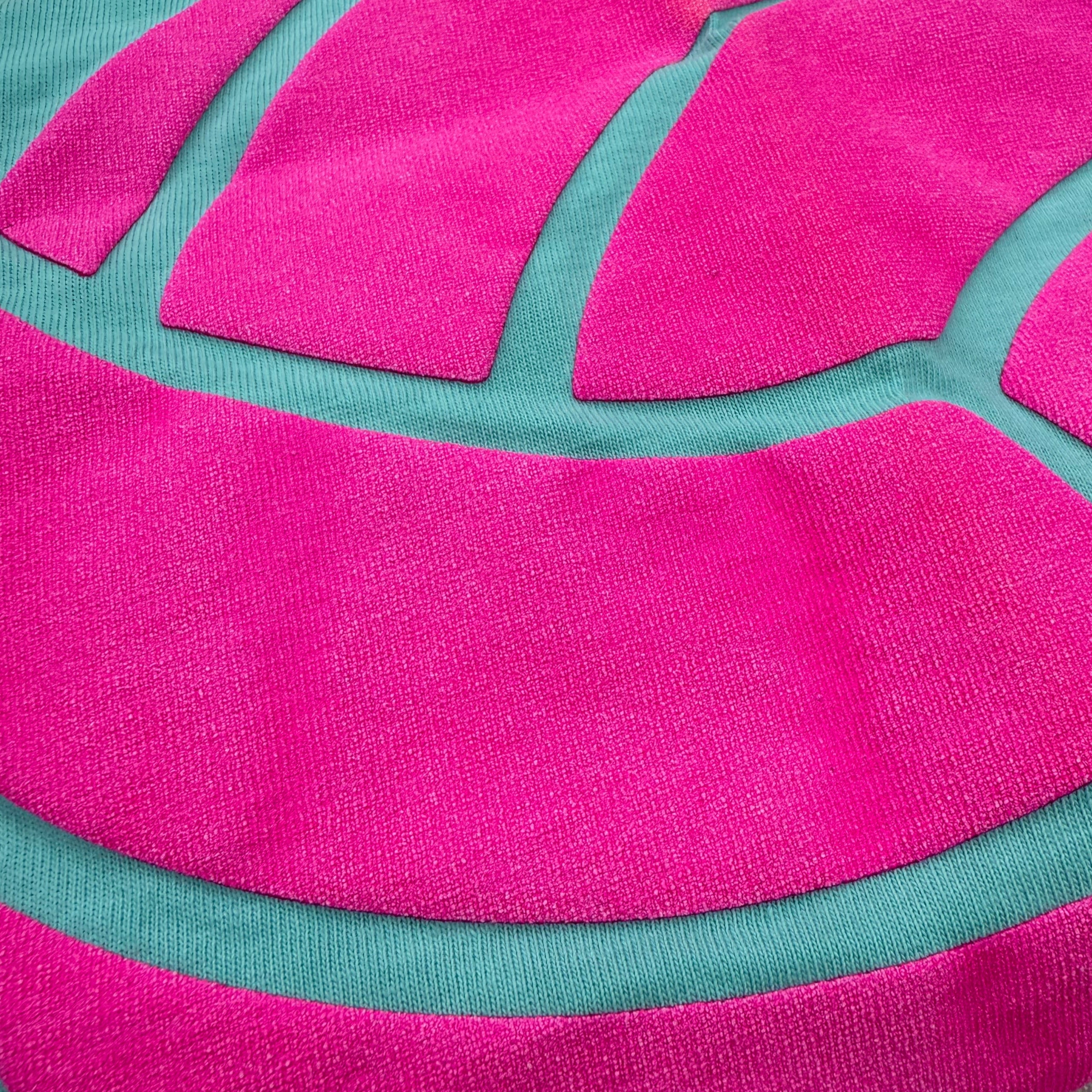 Pink volleyball puff print on teal volleyball t-shirt