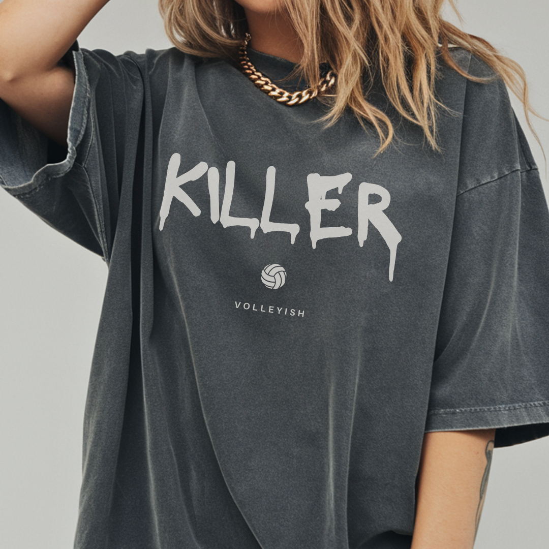 Girl wearing a gray volleyball t-shirt with 'KILLER' printed on it with volleyball graphic