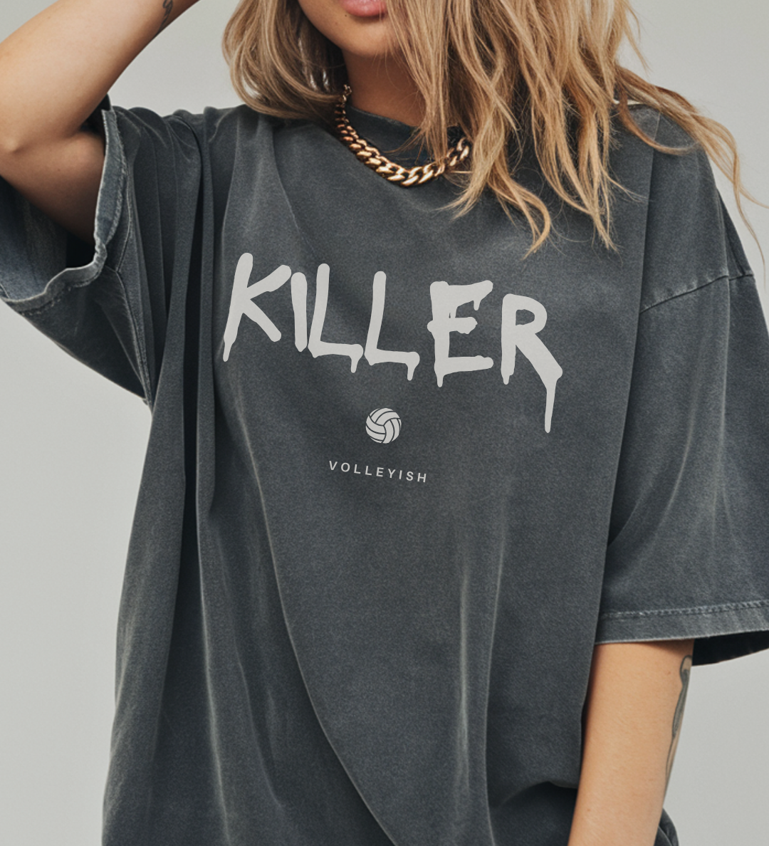 Girl wearing a gray volleyball t-shirt with 'KILLER' printed on it with volleyball graphic
